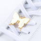 Butterfly sneaker pendant finished in yellow gold