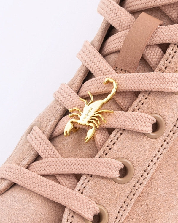 Scorpion sneaker pendant finished in yellow gold