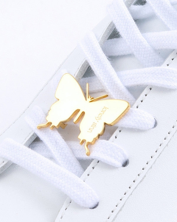 Butterfly sneaker pendant finished in yellow gold