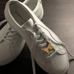 Butterfly sneaker pendant finished in yellow gold