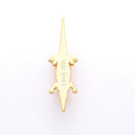 Crocodile sneaker pendant finished in yellow gold