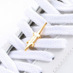 Crocodile sneaker pendant finished in yellow gold