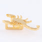 Scorpion sneaker pendant finished in yellow gold